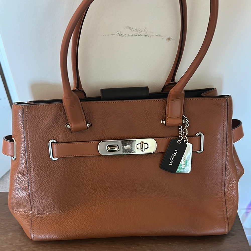 Coach Tan Shoulder Bag with Elegant Lock Closure